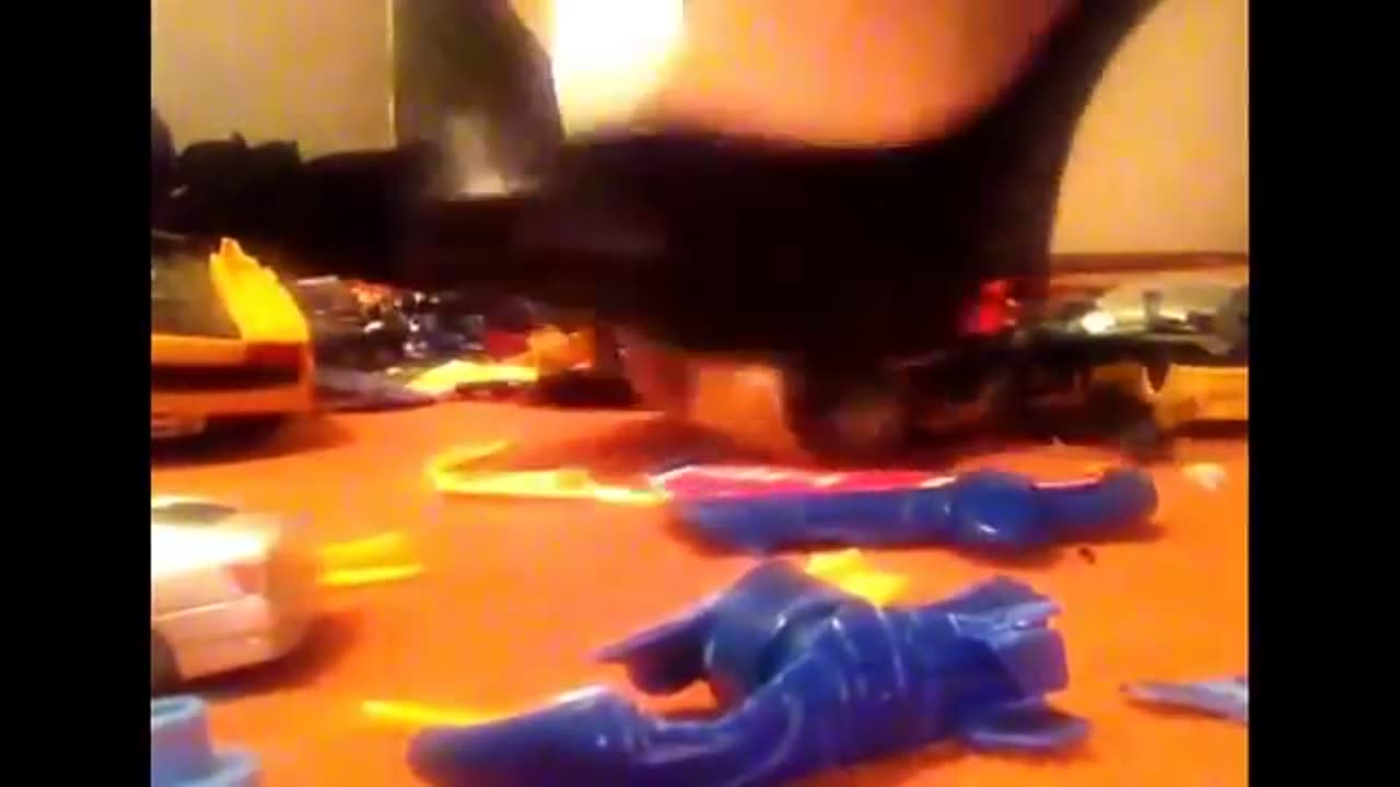 Toys Crushed Under Black High Heels