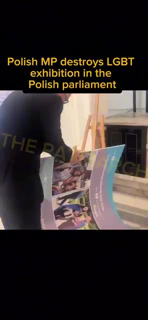 Polish MP vandalizes LGBT exhibition in the Polish parliament - Grzegorz BRAUN