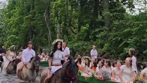 Young Poles celebrating midsummer in accordance with ancient Slavic traditions.