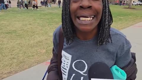 Jeff Hunt interviews people at Bernie Sanders AOC rally in Denver Co