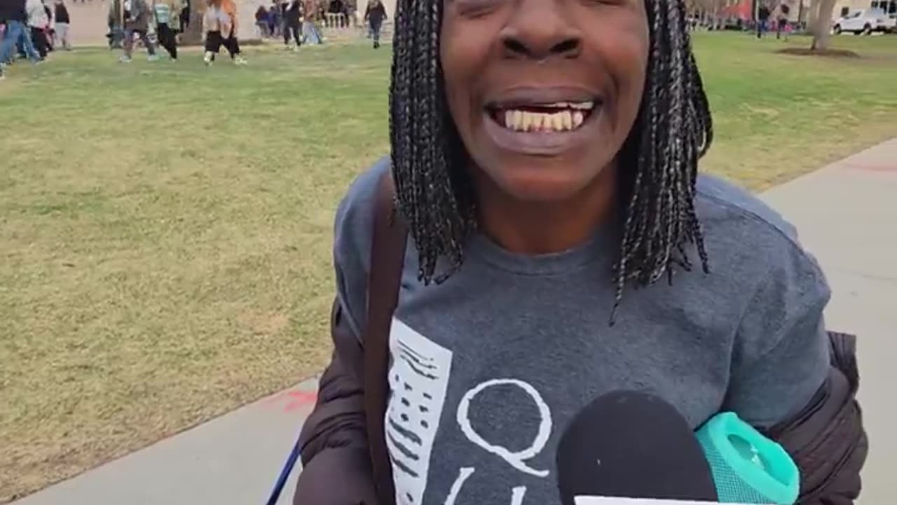 Jeff Hunt interviews people at Bernie Sanders AOC rally in Denver Co