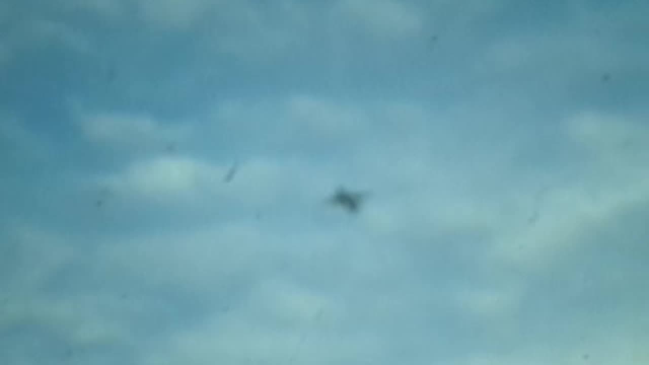 Trying to film jet in the sky, turns into a blurry UFO!