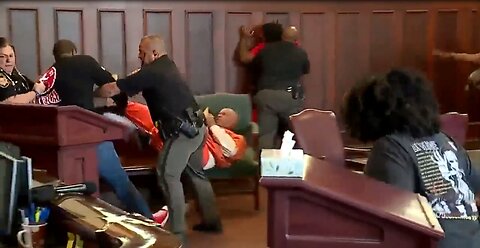 Brothers attack their mother's accused killer. Fight, chaos in court house.