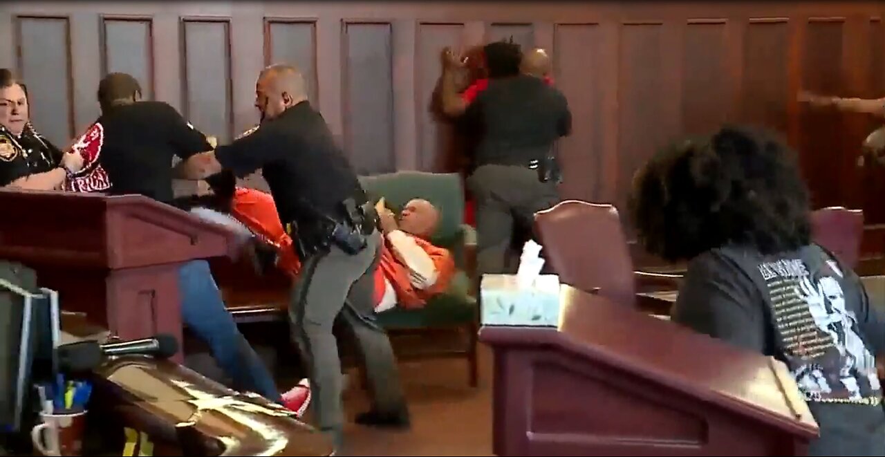 Brothers attack their mother's accused killer. Fight, chaos in court house.