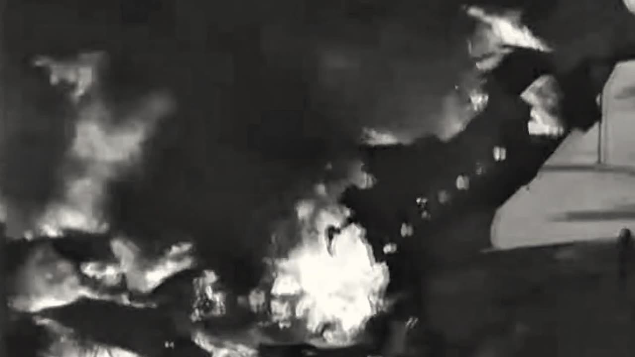 C-54 Skymaster burns after a raid by North Korean fighters on Suwon Air Base on June 28th 1950