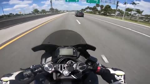 Cop purposely slams on brakes, causing biker to crash into him on the highway