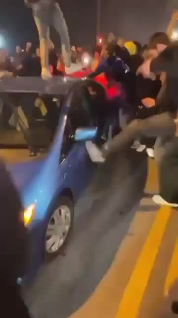 Mob Of Brown Savages Wreck Random Car