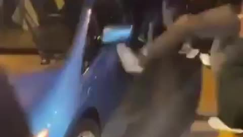 Mob Of Brown Savages Wreck Random Car
