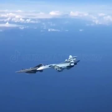 A Russian Su-27 chases away a US F15