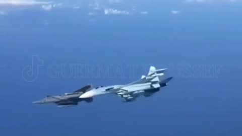 A Russian Su-27 chases away a US F15