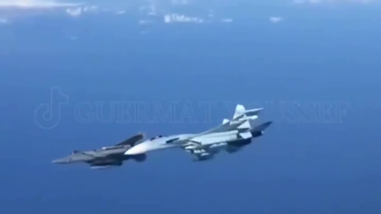 A Russian Su-27 chases away a US F15