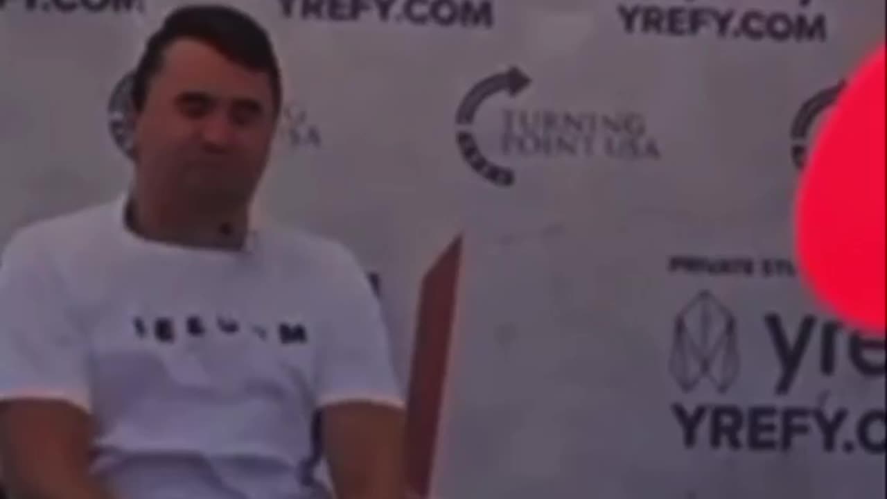 Mystery Floating Red Dot on Shirt of Charlie Kirk