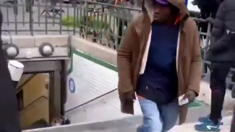 Migrant pushes White woman down stairs