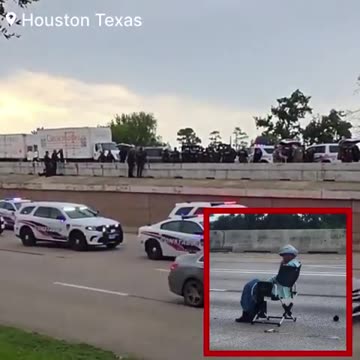 An armed sheboon sitting in a lawn chair has shut down Interstate 45 in Houston Texas