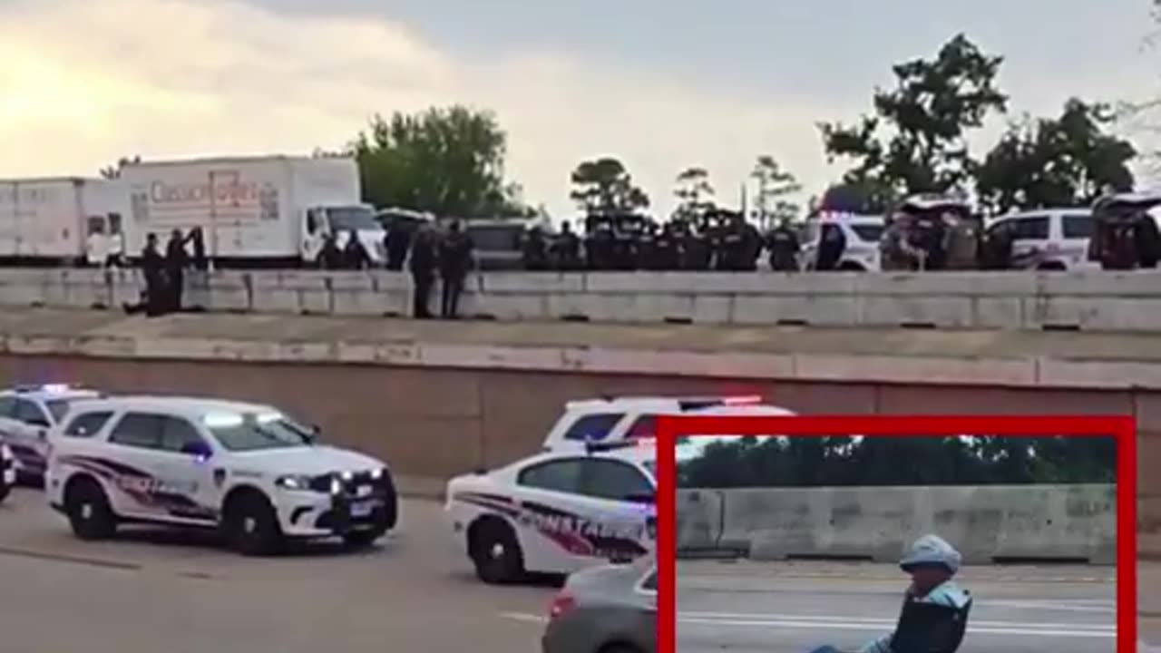 An armed sheboon sitting in a lawn chair has shut down Interstate 45 in Houston Texas