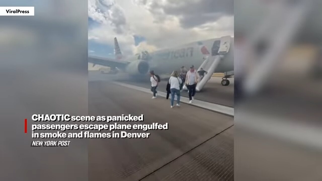 CHAOTIC scene as panicked passengers escape plane engulfed in smoke and flames in Denver