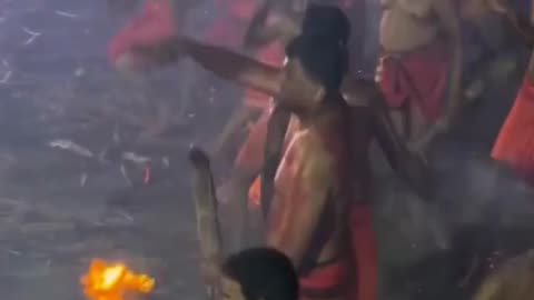 Devotees hurl flaming torches in fiery, centuries-old temple ritual