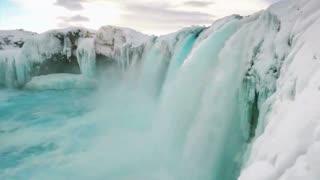 "Frozen Majesty: A Cinematic Drone Flight Over Icy Waterfalls ❄️