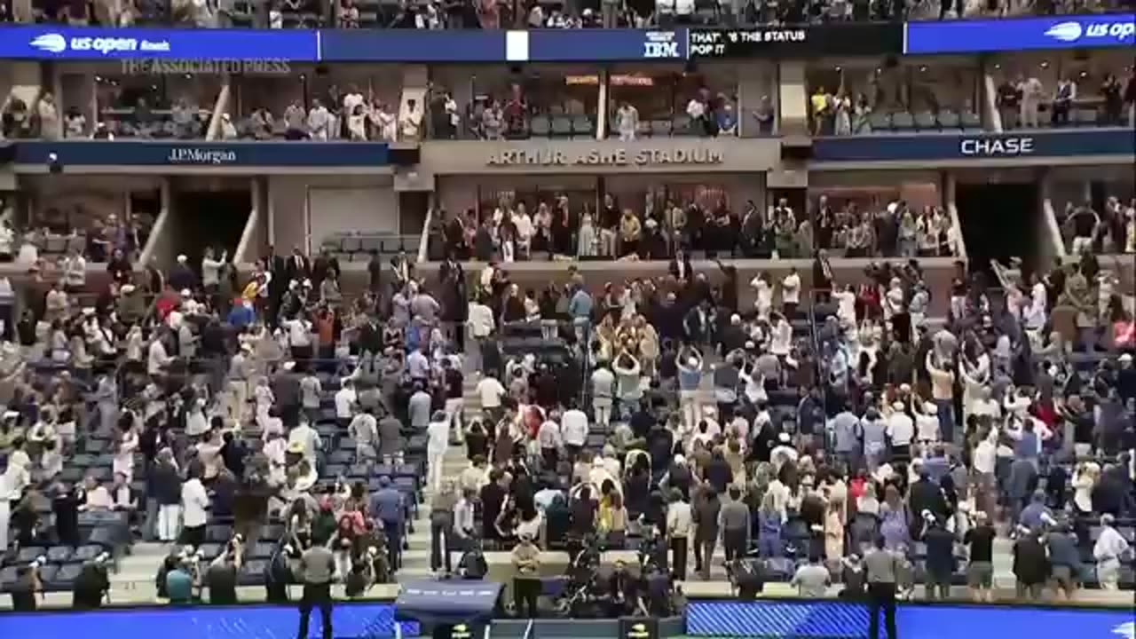 Trump receives a mix of cheers and boos as he attends the US Open
