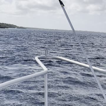 10,000 steps dive site approaching from bow of boat out of Divi Resort
