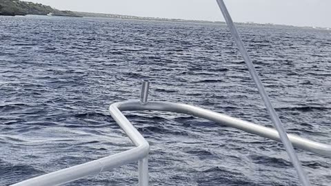 10,000 steps dive site approaching from bow of boat out of Divi Resort