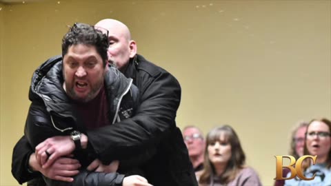 Ilhan Omar rushed by man on stage and sprayed with liquid at town hall event