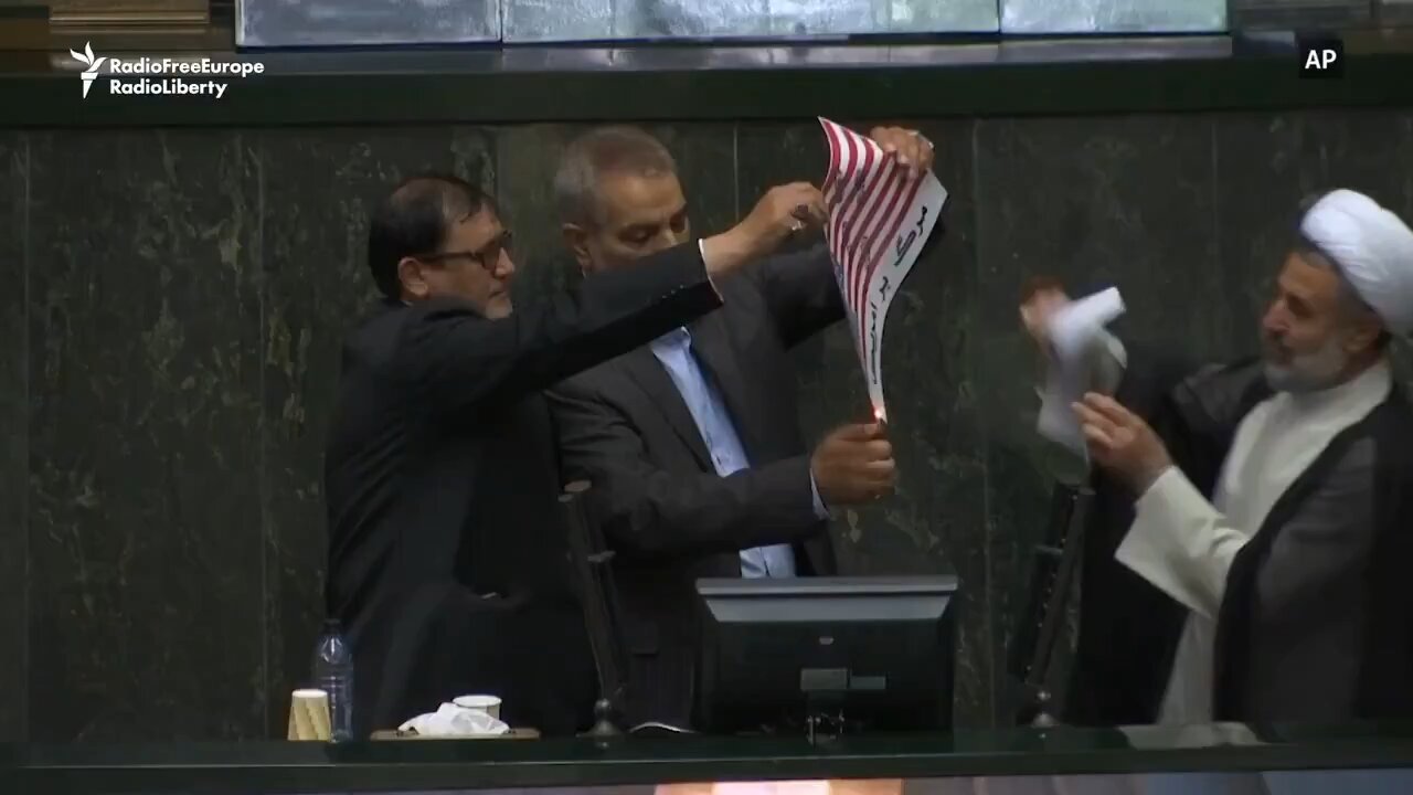 Iranian Parliament days ago. Burning a Flag.