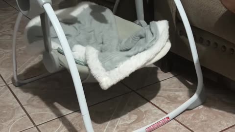 Absentmindedly Putting The Empty Rocker To Sleep