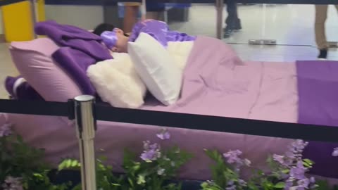 Man Sleeps On Mall Mattress Display