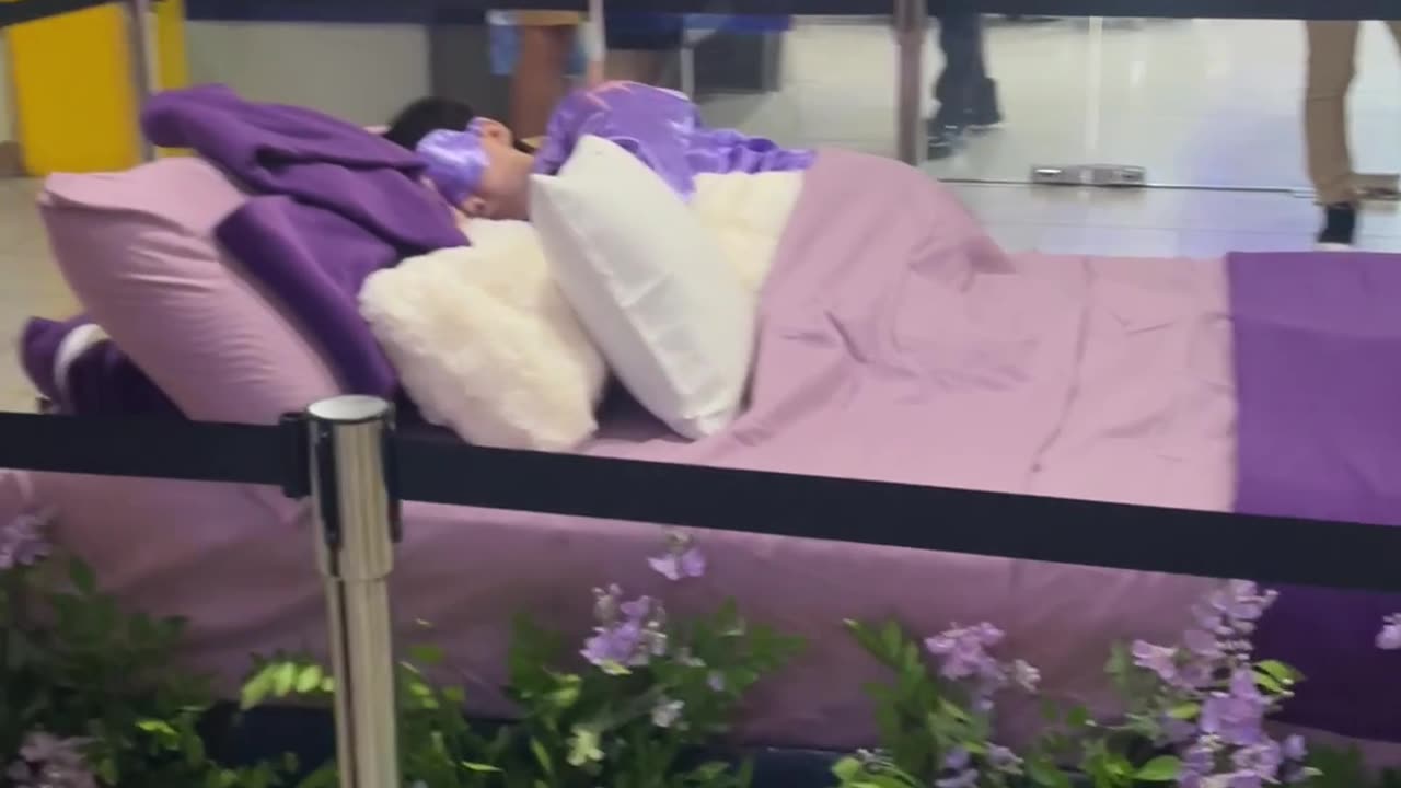 Man Sleeps On Mall Mattress Display