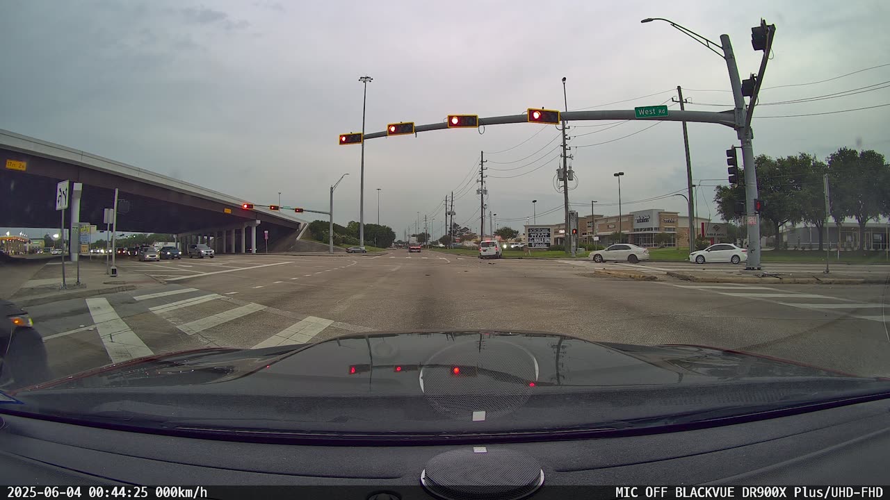 Van Runs Light At Beltway 8 On West Road