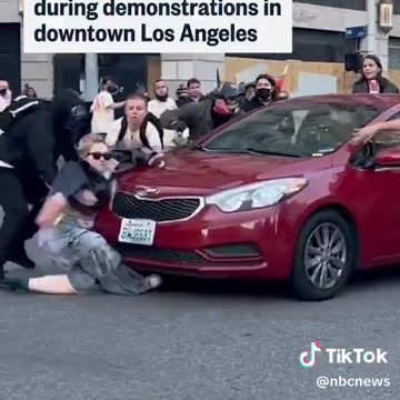 Car runs over a protester while trying to block the vehicle from leaving during protests