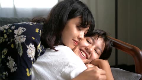Lesbian couple kissing on picnic blanket, Lovely