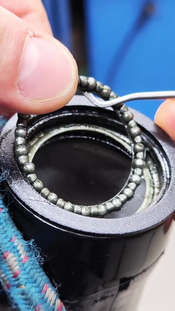 Disassembling the upper bearing of the bicycle headset.