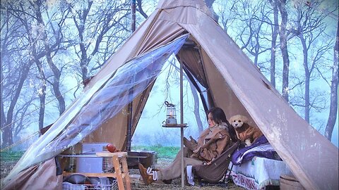 Grilling a Tomahawk steak on a wood-burning stove in front of a frozen lake