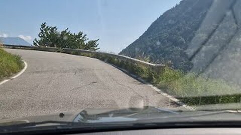 Hair-pin bends & narrow roads, driving in the Swiss Alps.