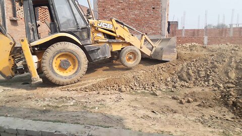 "Dumping soil using a JCB"