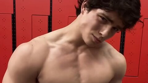 Young man flexing muscles