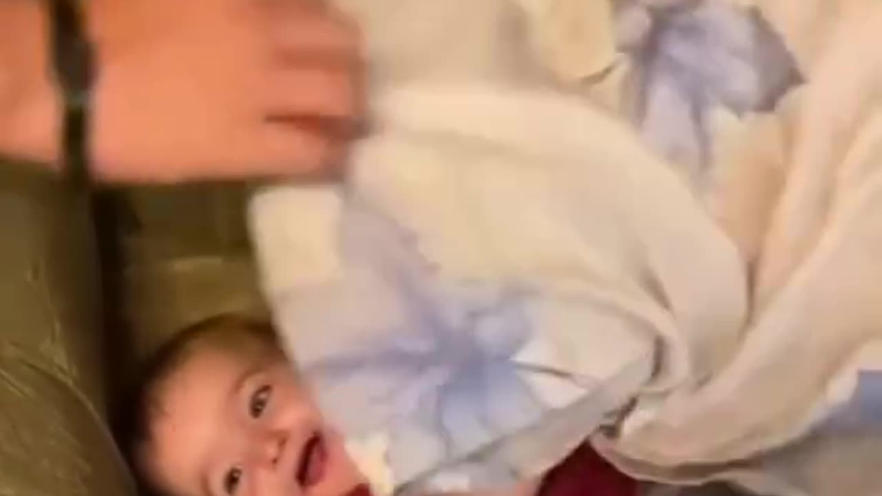 Cute baby is trying to hide