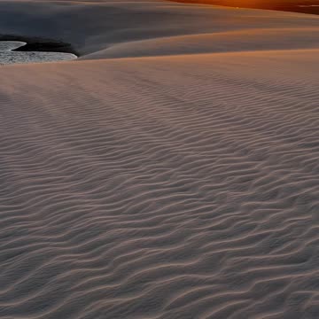 Captivating Desert Sunset Over Sand Dunes