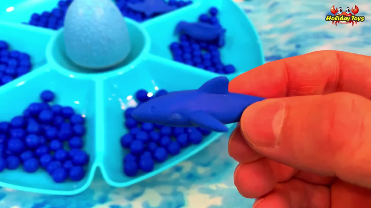 Blue Lobster and Blue Octopus Next to Large Container