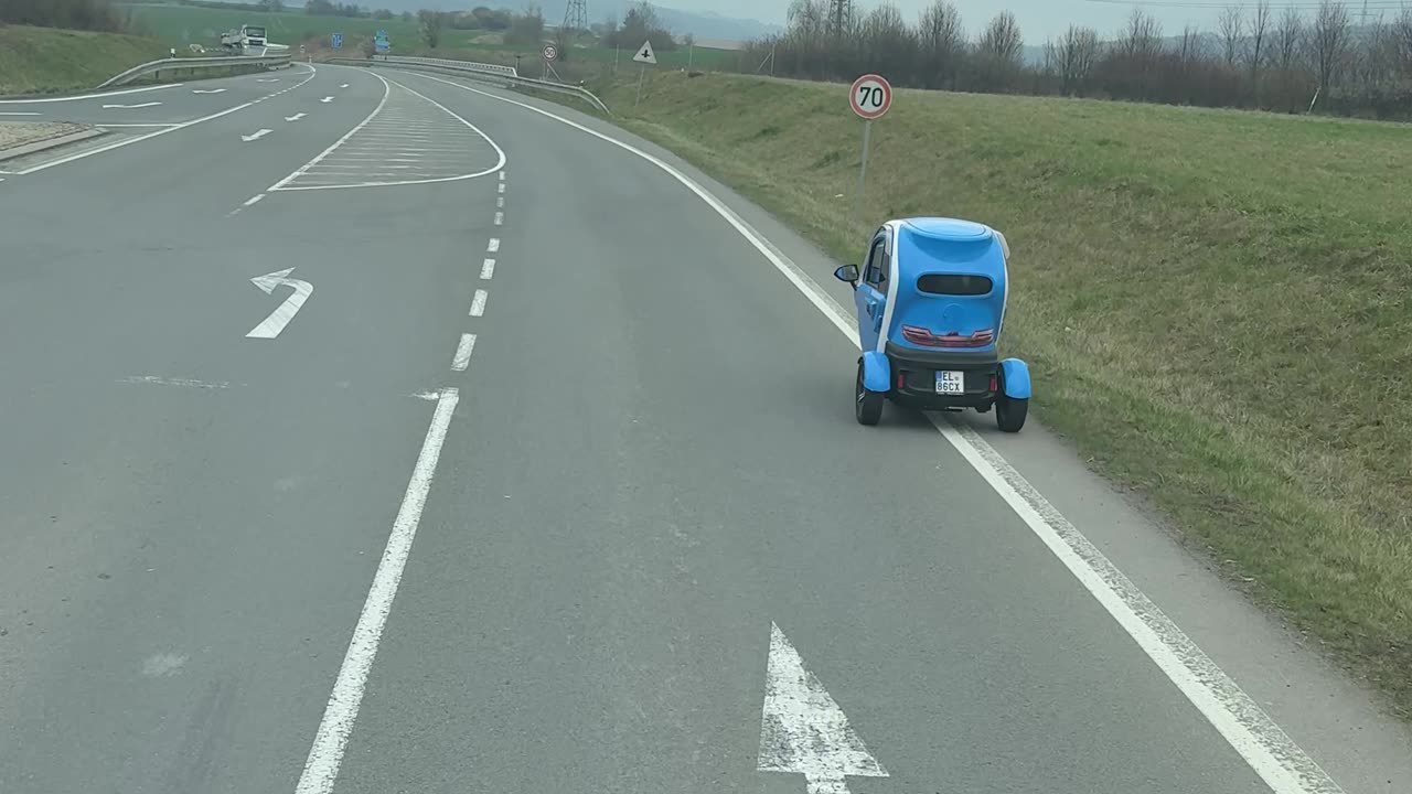 Tiny Vehicle Drives Along Czech Roadway