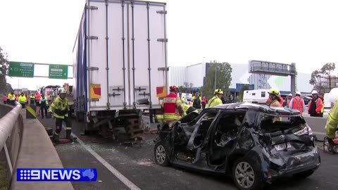 Woman rescued after horror crash on major motorway || 9 News Australia