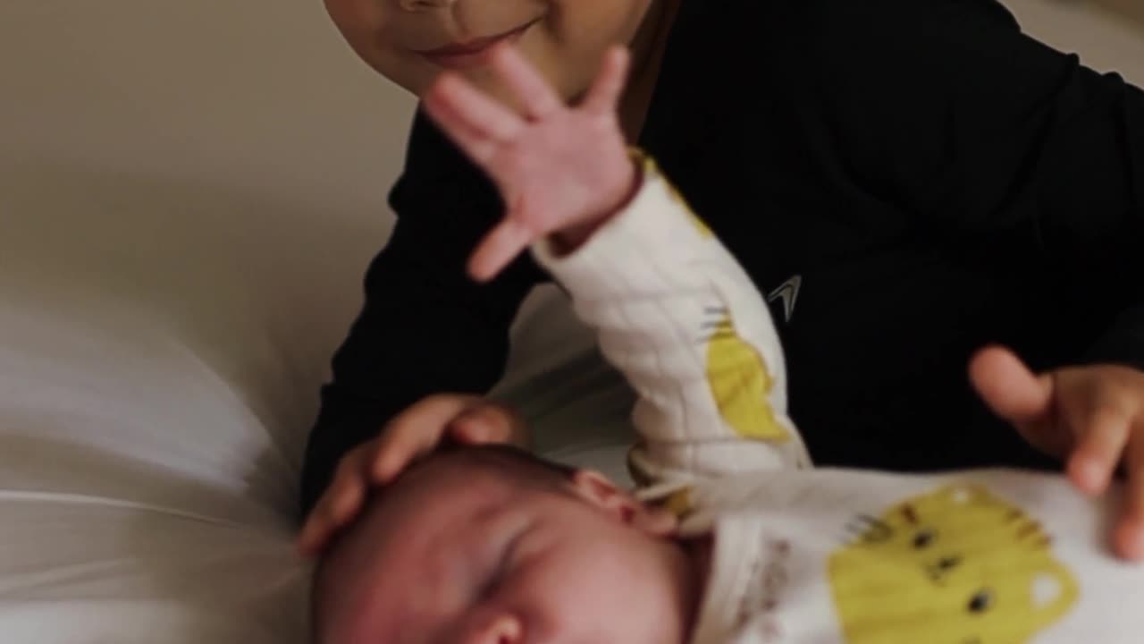 Adorable Sibling Bonding Moment on Bed