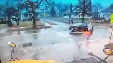 Brave crossing guard throws child out of the way and takes a nasty hit after car fails to stop