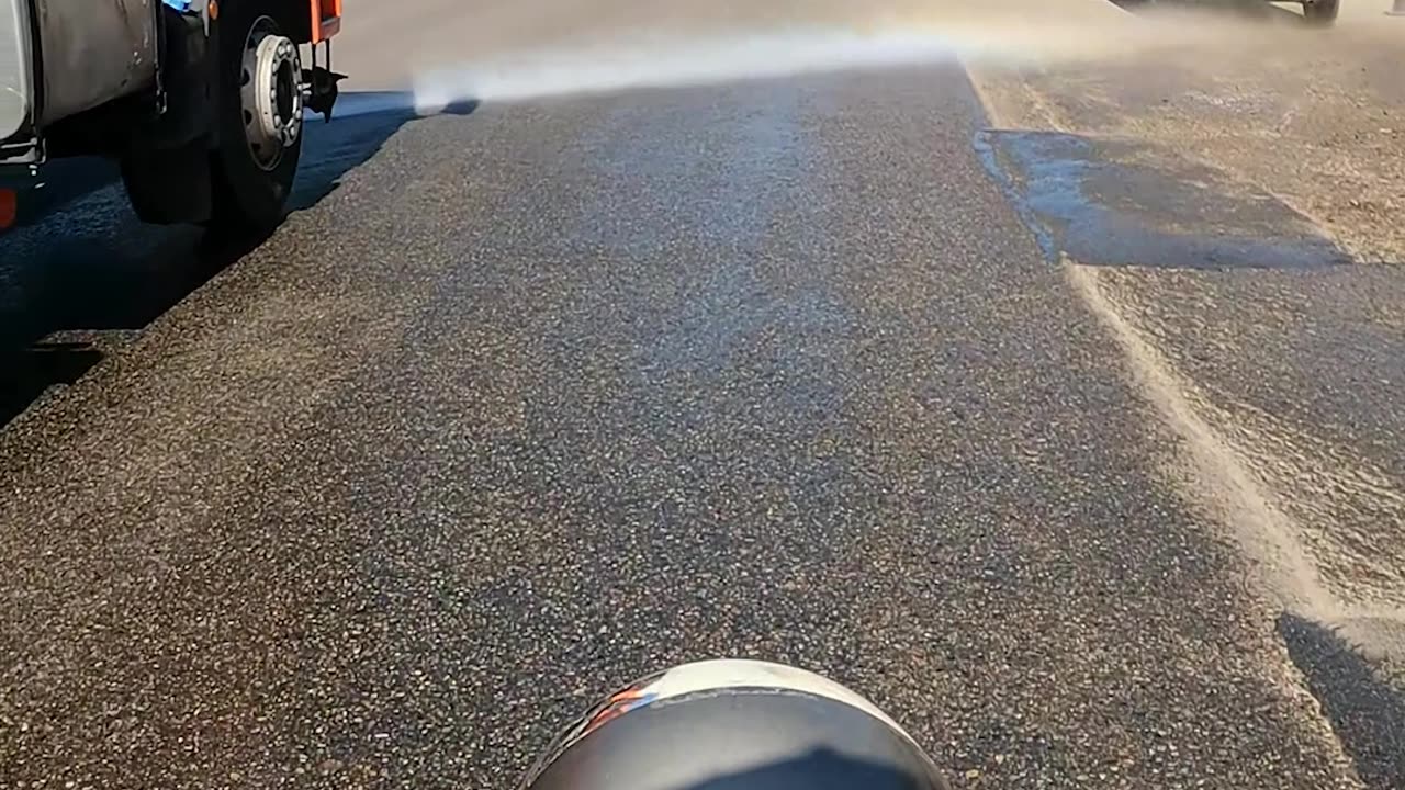 Scooter Tries To Zoom Past Street Cleaner