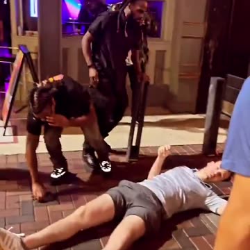 Blacks try to kick White man to death.