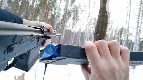 cutting a tree by AK saiga 12 shutgun