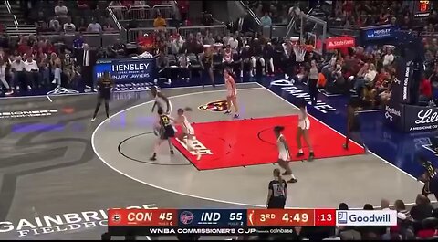 Indiana Fever's Caitlin Clark takes a hard foul from Marina Mabrey of the Connecticut Sun