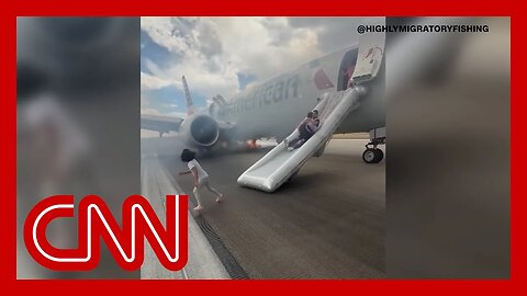 Passengers evacuate plane after landing gear incident sparks fire